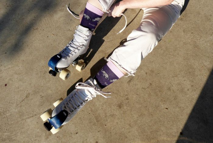 person putting on rollerskates