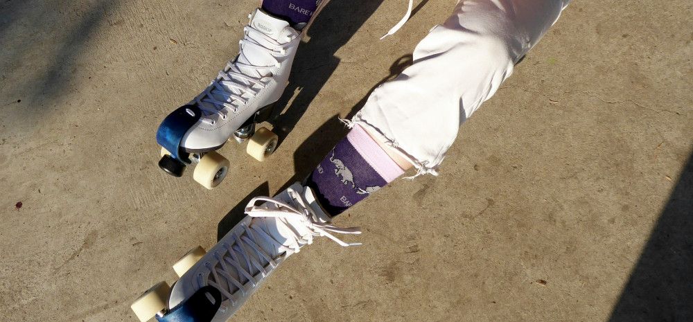 person putting on rollerskates