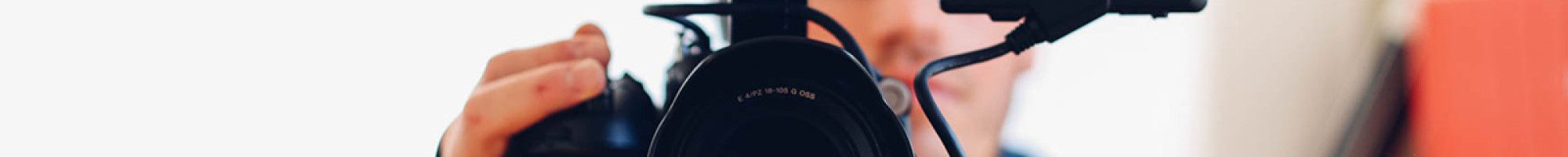 guy filming with camera