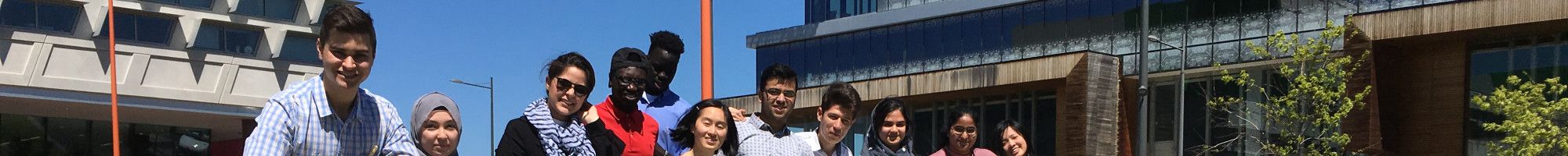 Taskforce standing with Harmony Square letters