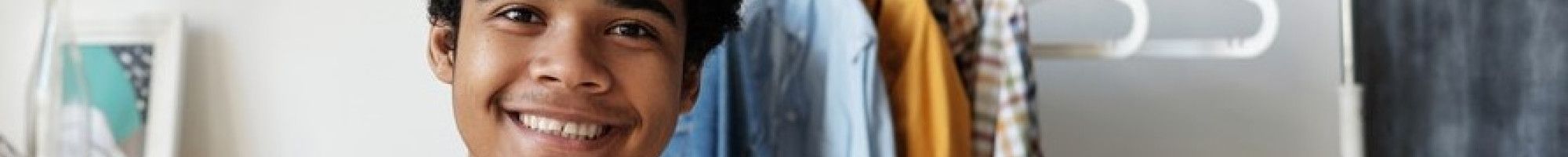 Young man smiling with iPad