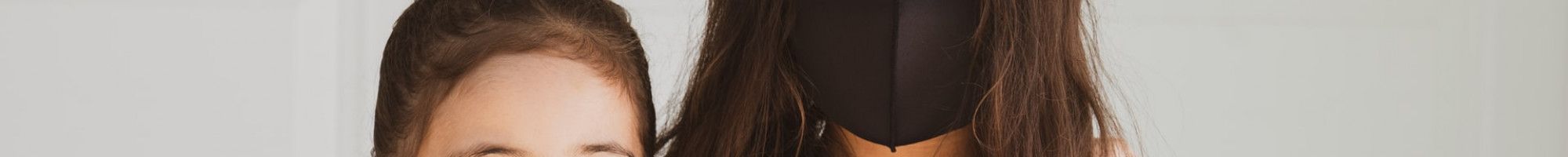 Sisters wearing face masks