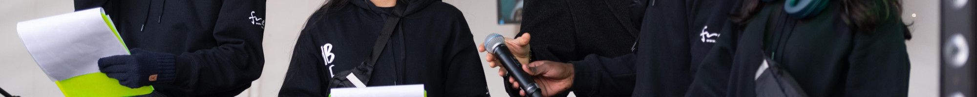 A group of young people MCing on stage