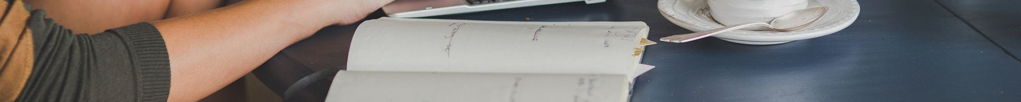 Young person typing on laptop 