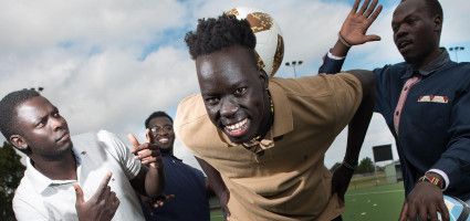 Group of guys having fun with a soccer ball